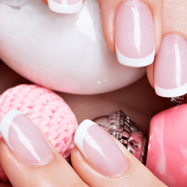 beautiful-woman-s-nails-with-beautiful-french-white-manicure 1-min