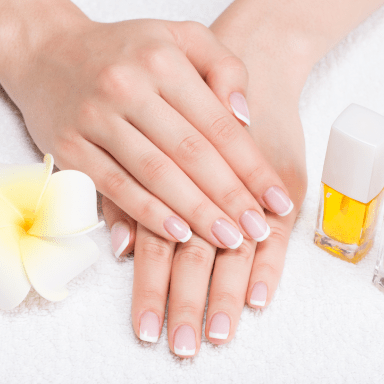 woman-nail-salon-receiving-manicure-by-beautician-beauty-treatment-concept 1-min